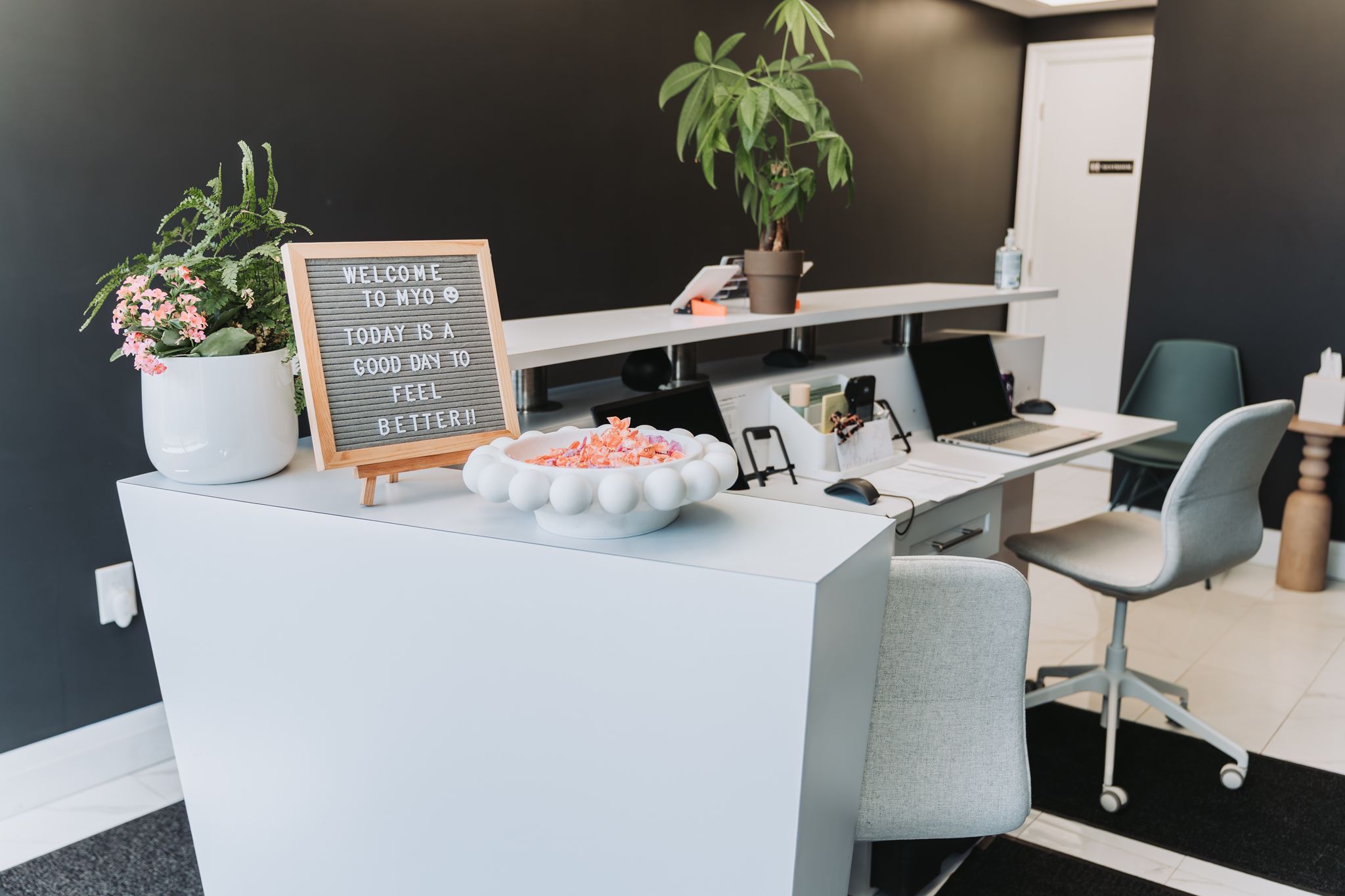Reception desk at MYO Massage Therapy Clinic with welcome sign